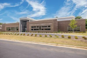 Henry Brigham Community Center exterior with a blue sky